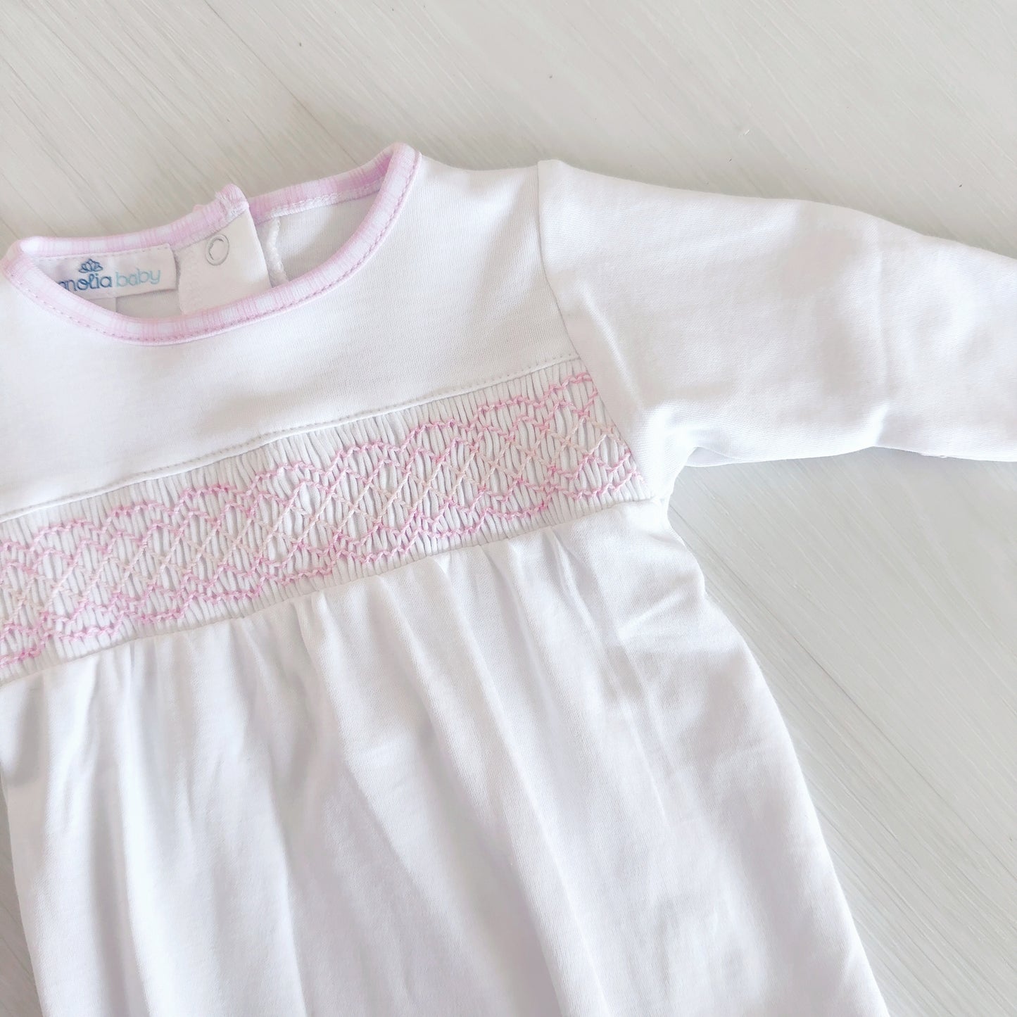 Megan White Smocked Footie (Pink Trim)